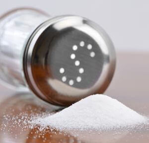 pile of salt next to a salt shaker low sodium diet
